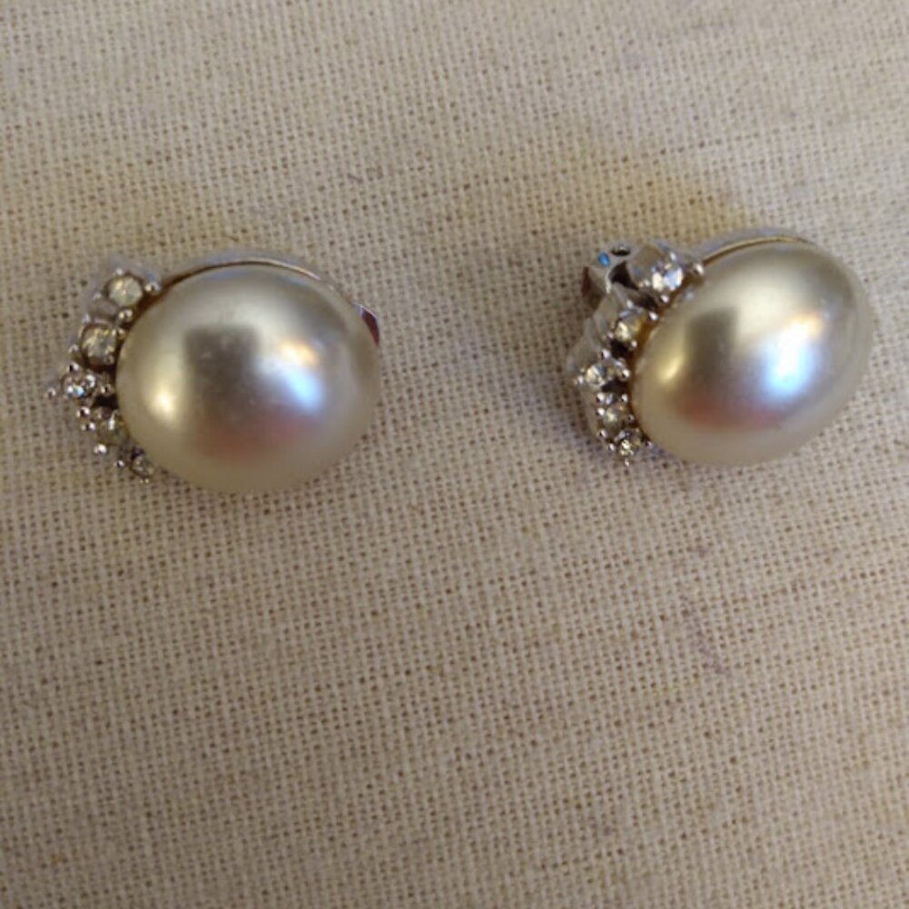 Marvella: Faux pearl and rhinestone clip earrings.